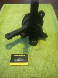 Spindle-knuckle, left-hand Nissan Micra K11 40015-74B00 Used part.