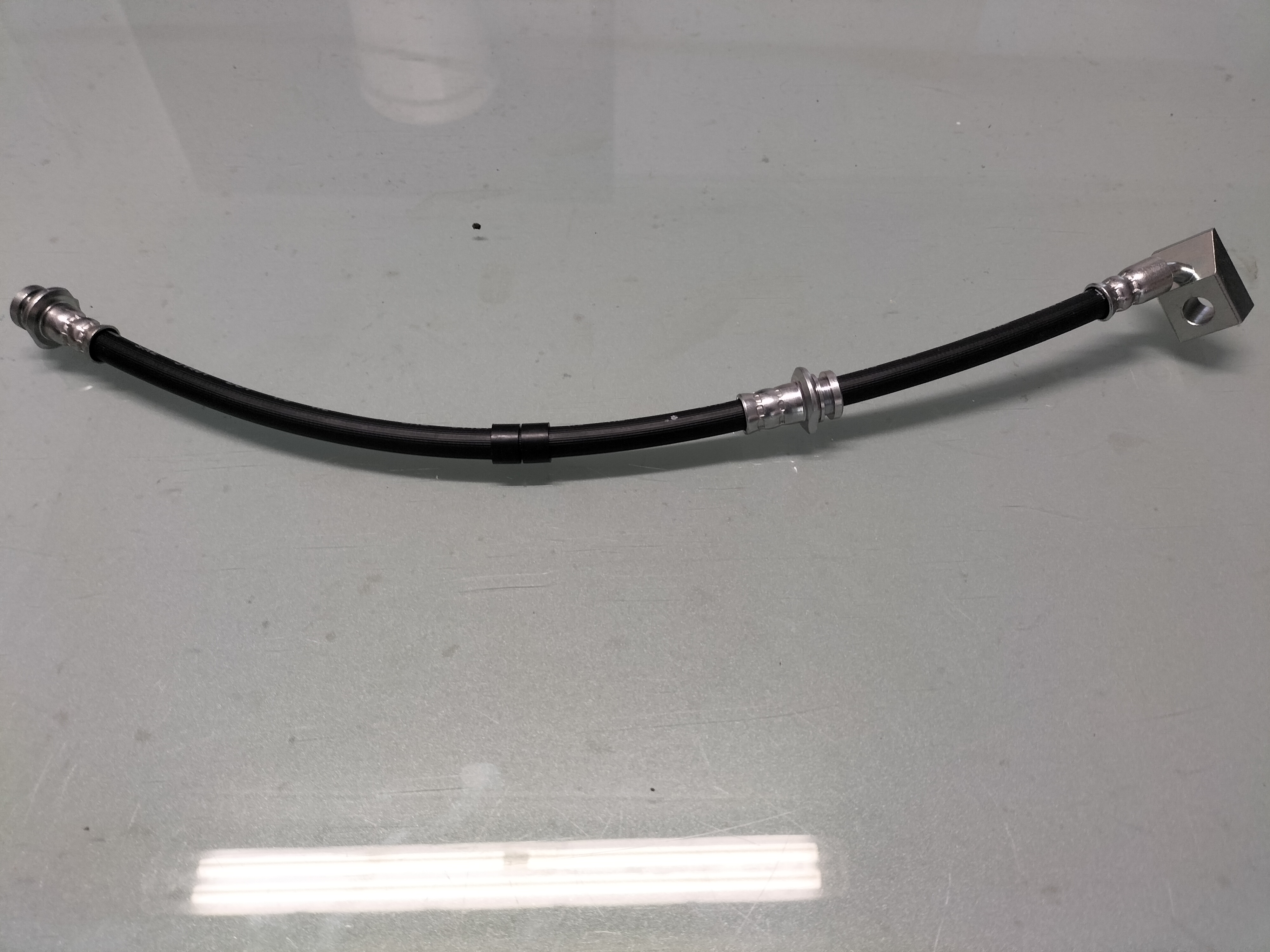Remslang linksvoor Nissan Bluebird T72 46210-Q9005 Nieuw.
