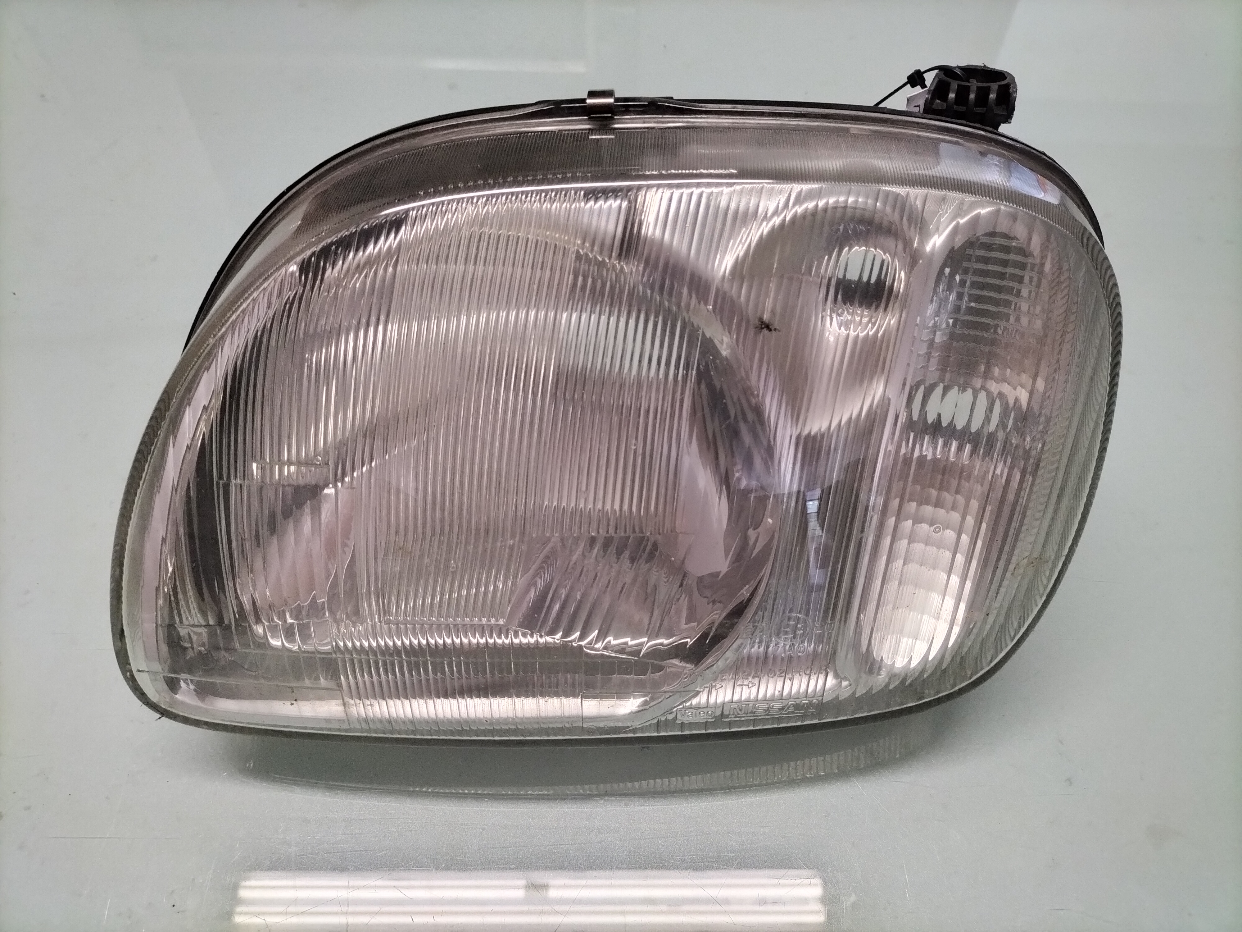 Koplamp Links Nissan Micra K11 26060-6F620 Gebruikt gerepareerd.