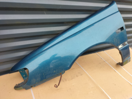 Zijscherm links Nissan Sunny N14 (FK1) 63101-62C30 Gebruikt.