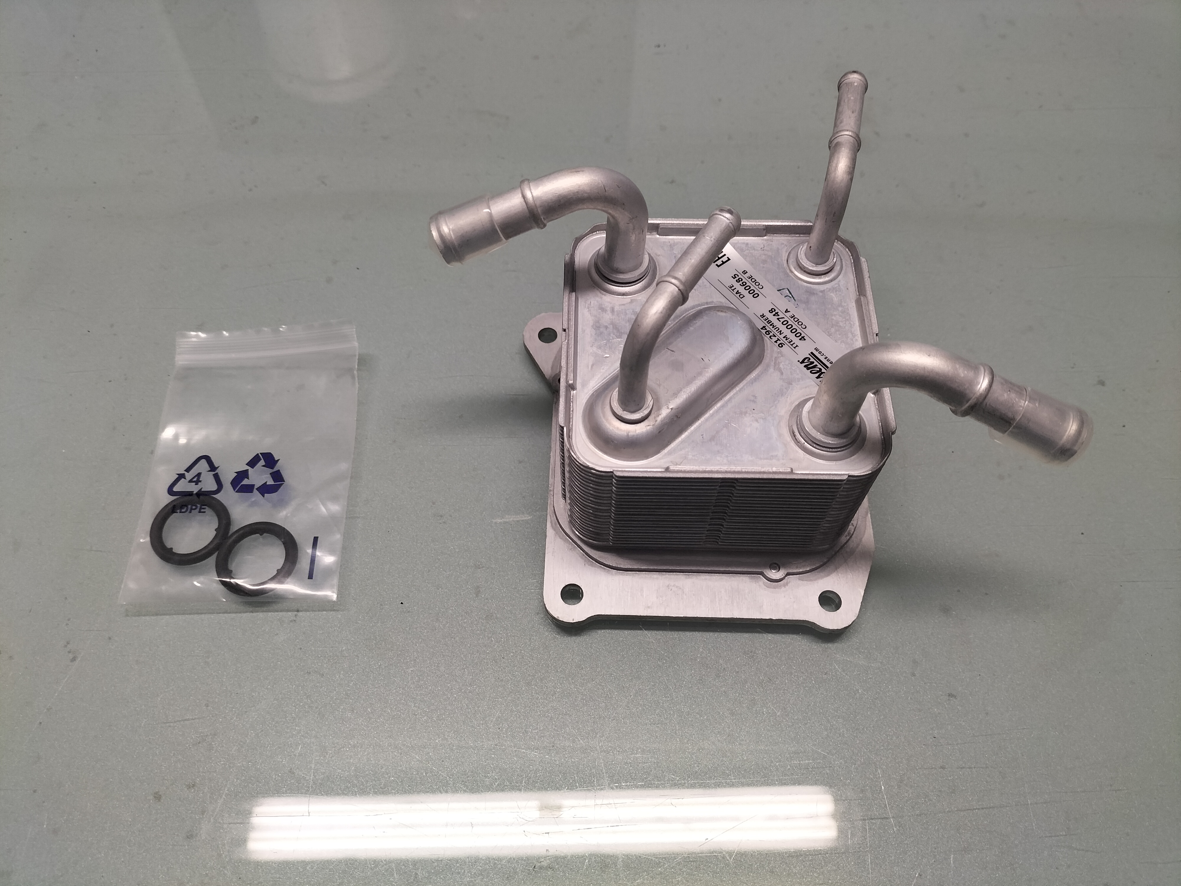 Oil cooler assy-auto transmission Nissan 21606-3JX2C F15/ J10/ JJ10 Nieuw.