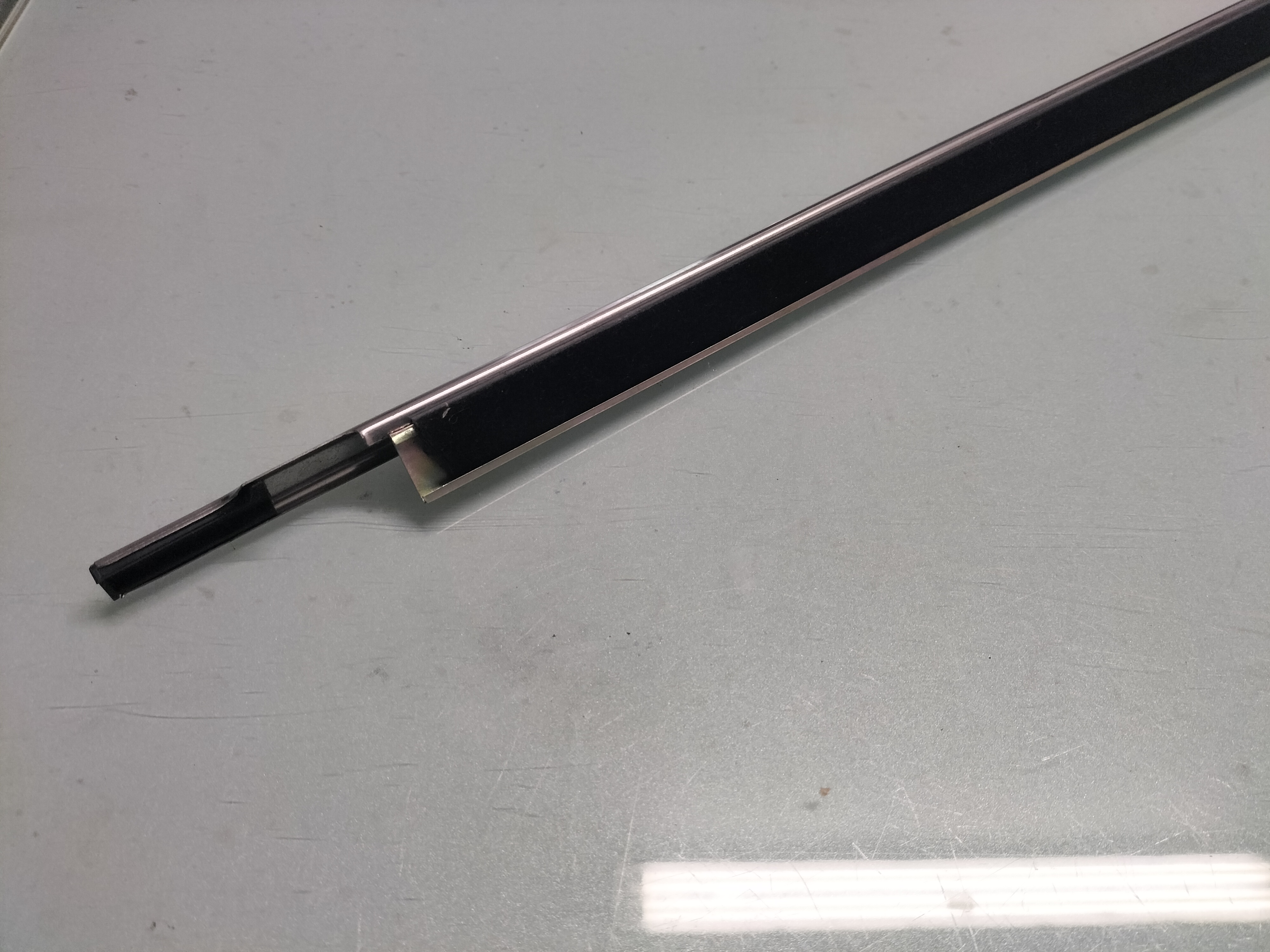 Deurstripbuitenzijde Nissan 80319-M0204 Origineel.