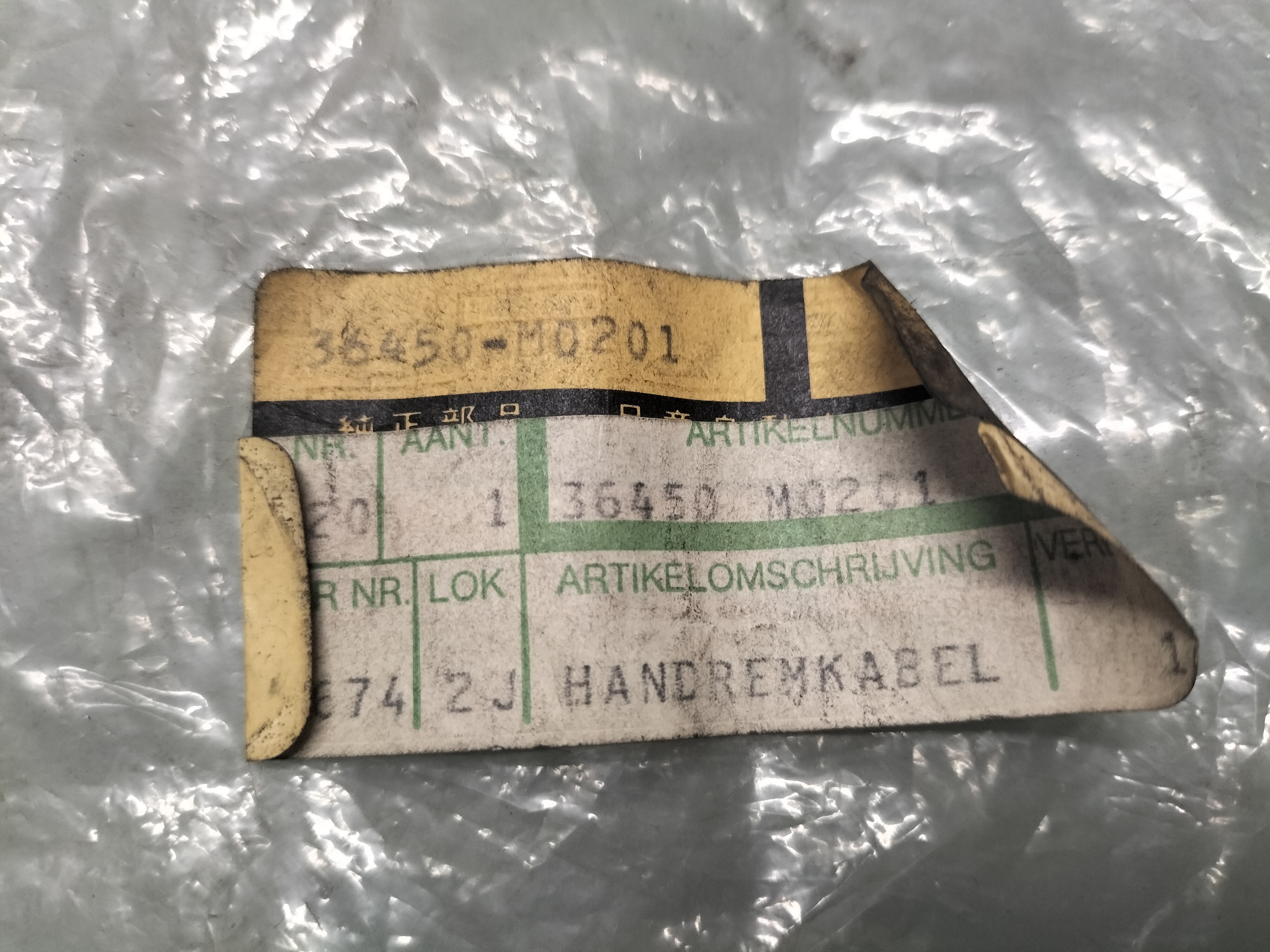 Handrem Kabel Nissan 36450-M0201 Origineel.