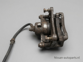 Caliper front right-hand, without pads or shims Nissan Micra K11 41001-99B00 Used part.