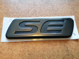 Emblem-trunk lid SE Nissan Primera P11/WP11 84896-2F400 Original.