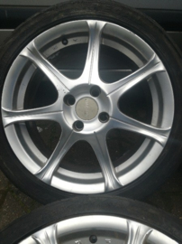 16 inch aluminium velgen met band 215/40R16 4x100 ET38 16X7JJ naafgat 59,1 B13/N14/N15