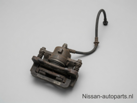 Caliper front right-hand, without pads or shims Nissan Micra K11 41001-99B00 Used part.