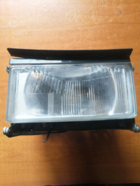 Koplamp met montageframe rechts Nissan 300ZX Z31 26010-07P00 Gebruikt.