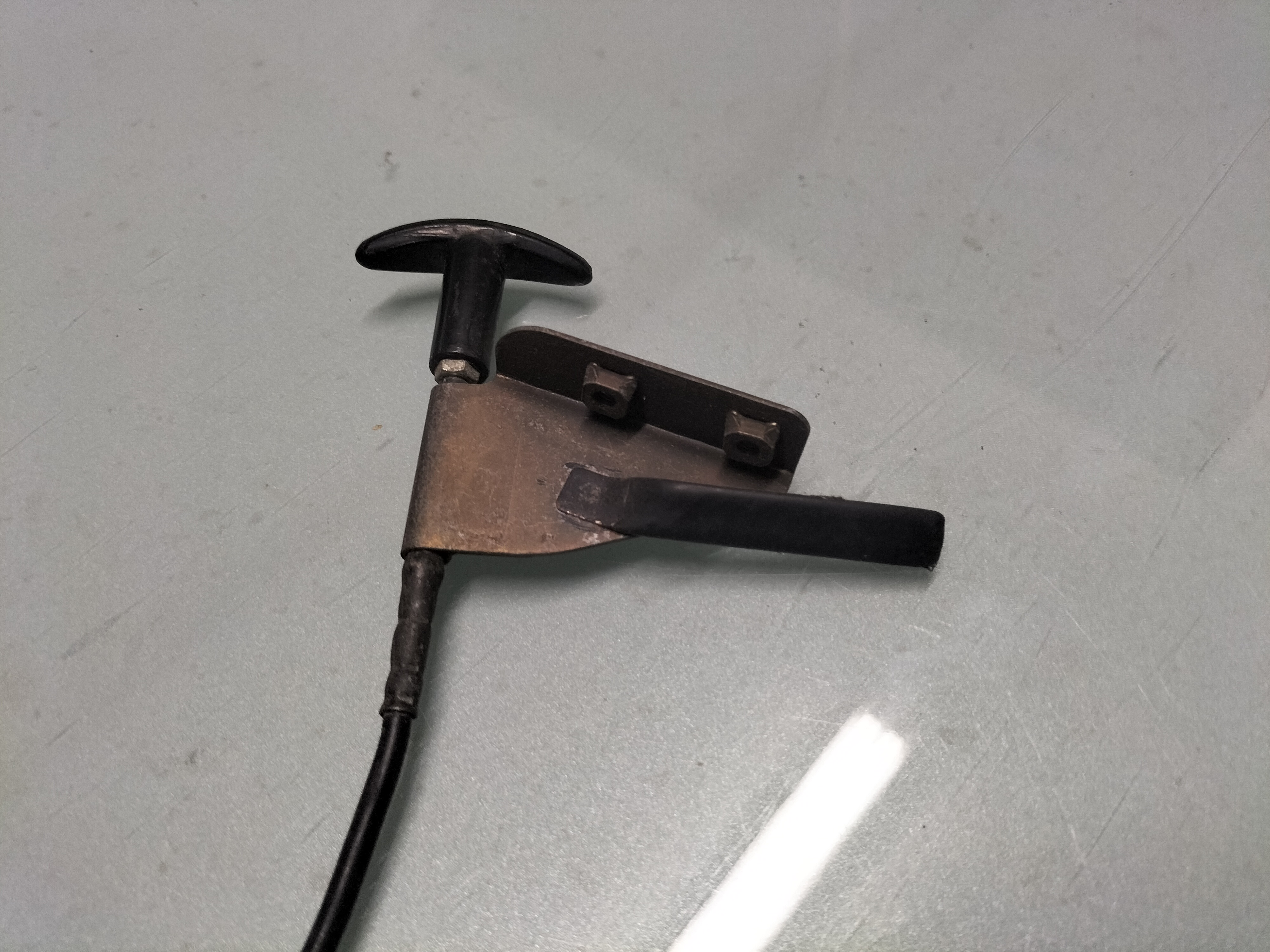 Assy-control, hood lock Datsun Cherry E10 65660-M1003 Used part.