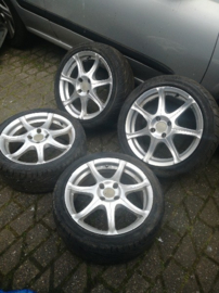 16 inch aluminium velgen met band 215/40R16 4x100 ET38 16X7JJ naafgat 59,1 B13/N14/N15