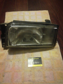 Koplamp links Nissan Terrano2 R20 26060-0F001 Gebruikt.