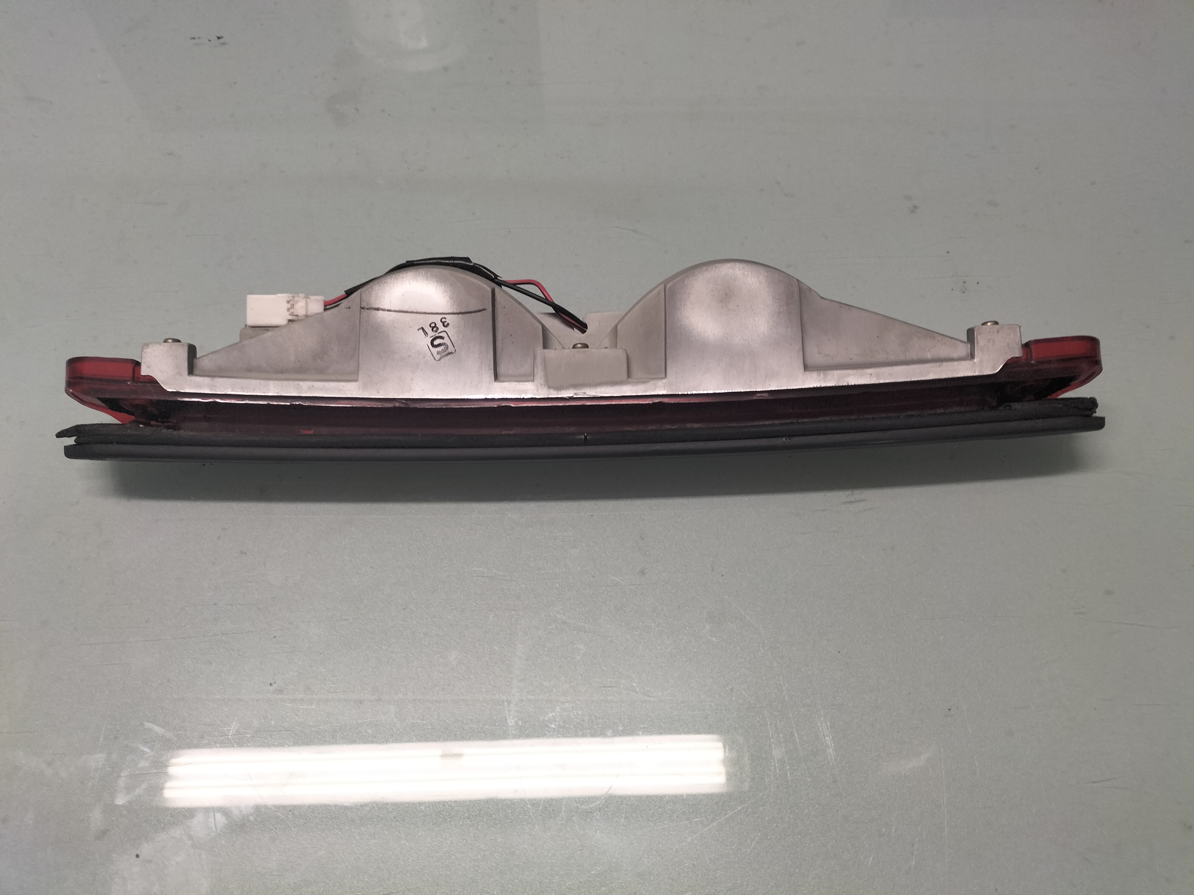 Lamp stop, high mounting Nissan 100NX B13 26590-67Y00 Used part.