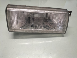 Koplamp rechts Nissan B6010-60A01 Gebruikt-Lichte Schade.