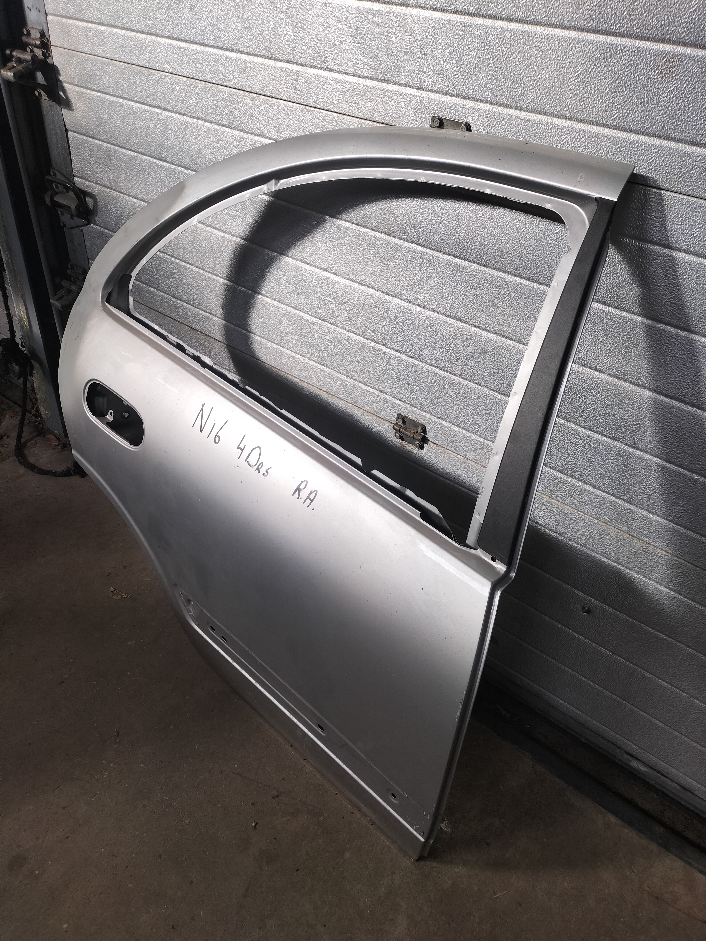 Door-rear, right-hand Nissan Almera N16 sedan 82100-9M730 gray.