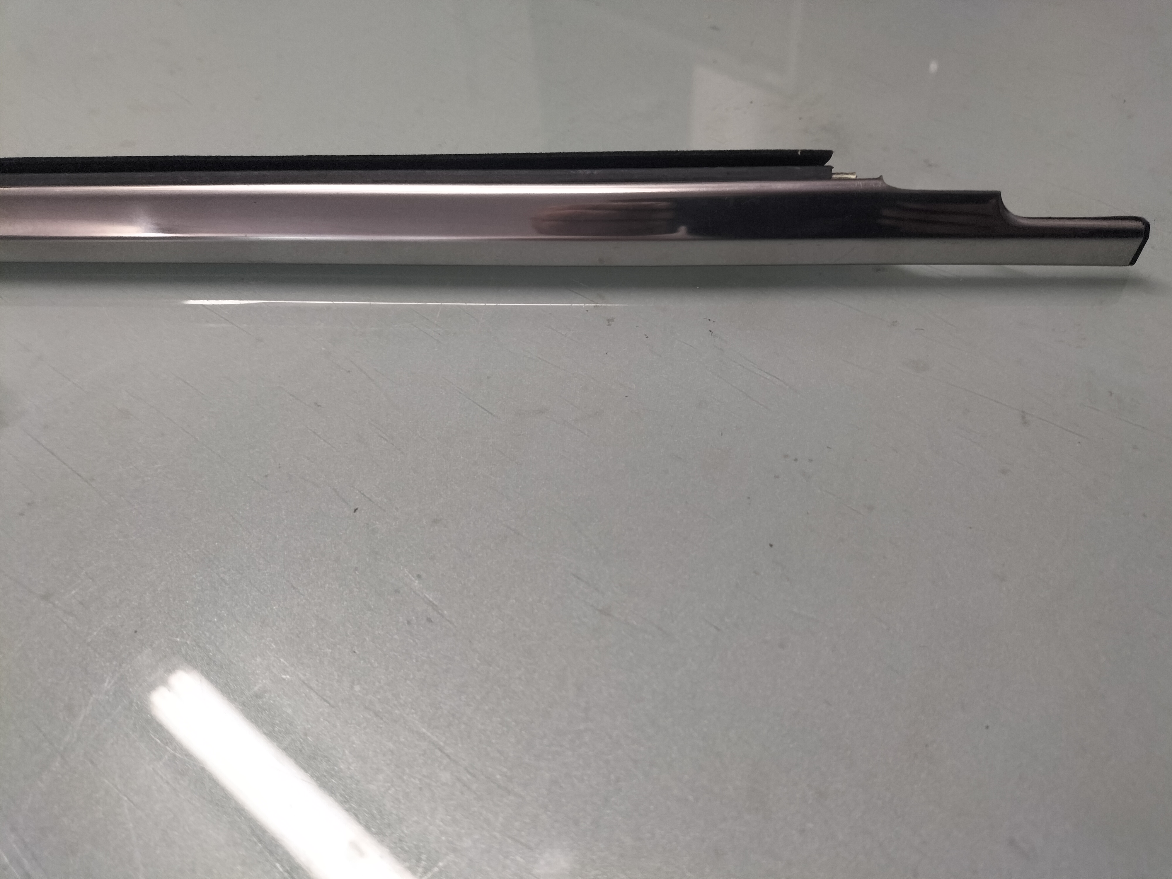 Deurstripbuitenzijde Nissan 80319-M0204 Origineel.