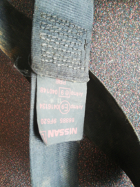 Belt tongue, pretensioner front left-hand Nissan Primera P11 / WP11 86885-9F520 Used part.
