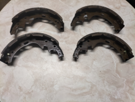 Shoe-set rear brake 254 X 60 Nissan King Cab D21 DD060-31G25 Original.