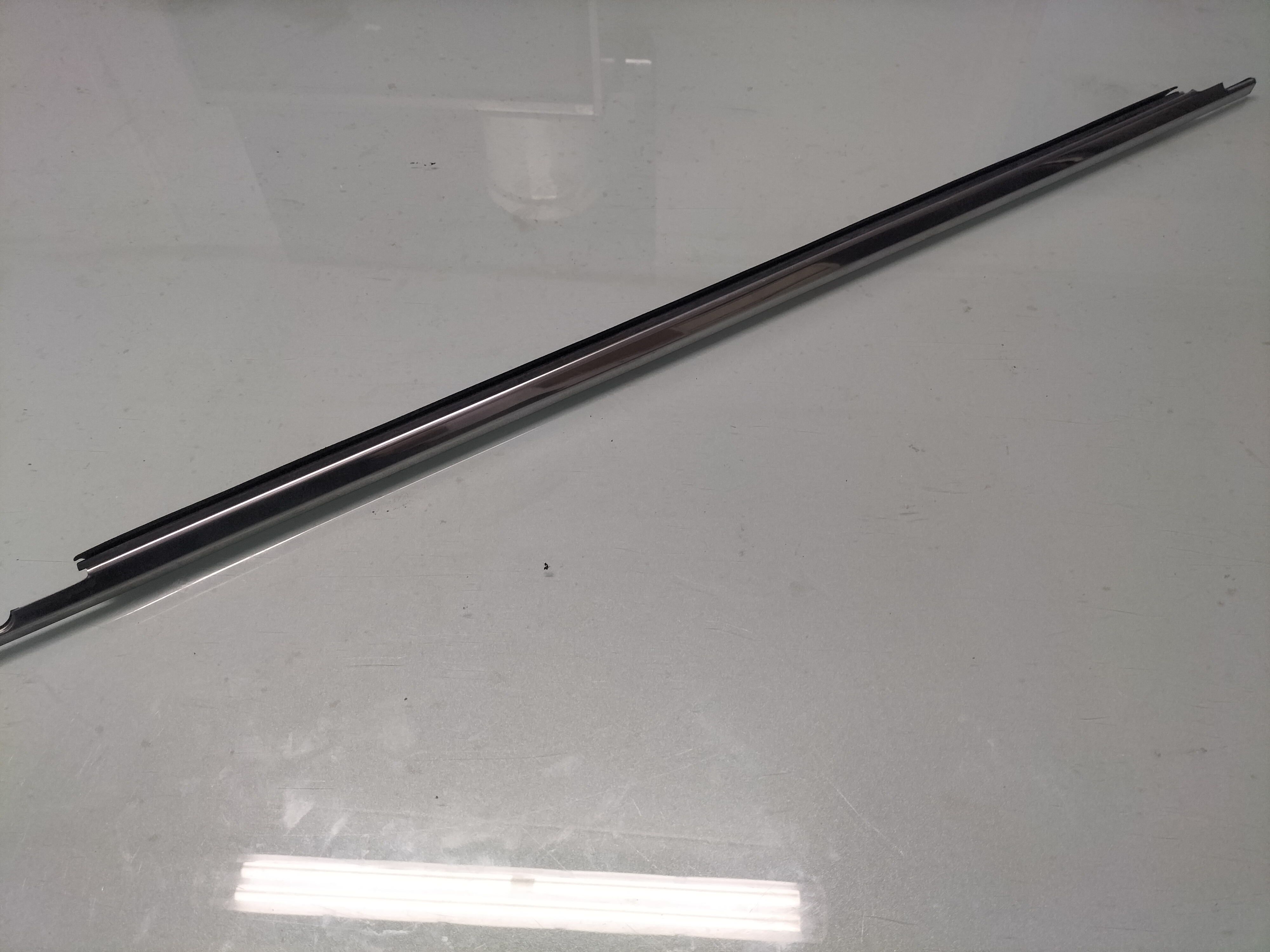 Deurstripbuitenzijde Nissan 80319-M0204 Origineel.