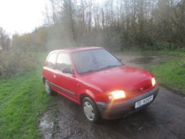 Koplamp rechts Nissan Micra K11 B6010-5F206 Lichte schade