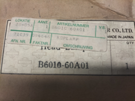 Koplamp rechts Nissan B6010-60A01 Gebruikt-Lichte Schade.