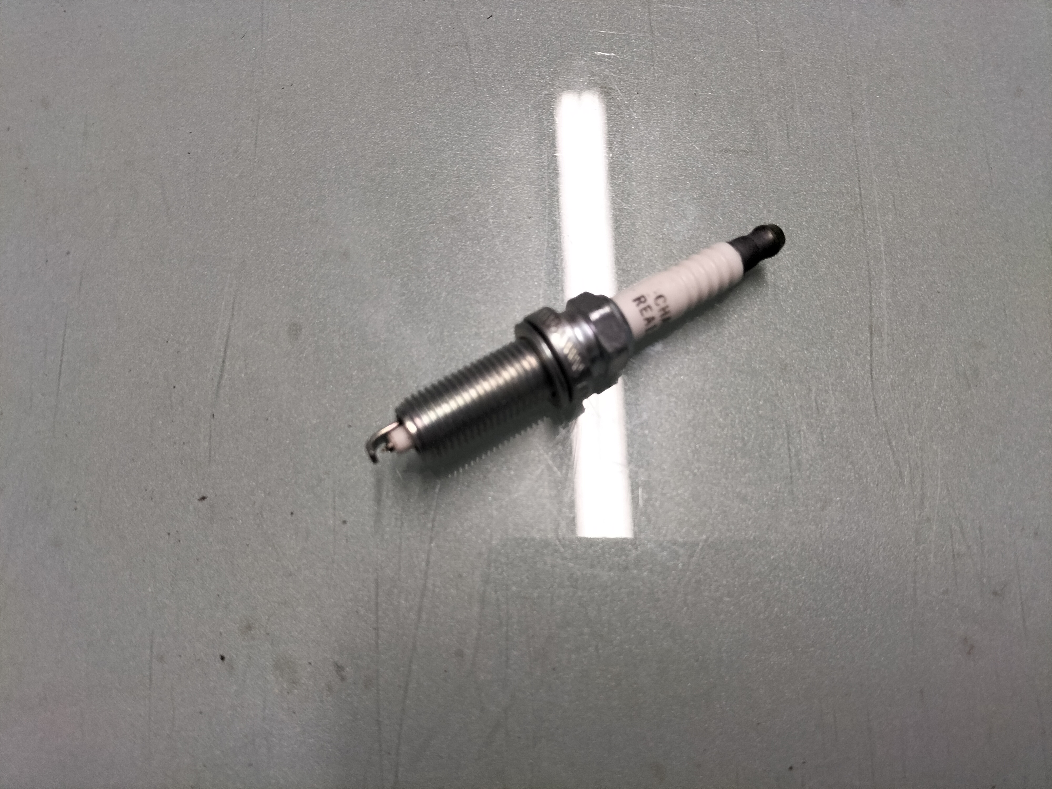 Spark plug Nissan 22401-1HC1B ( REA12WMB4 ) Original.