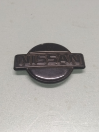 Embleem voorzijde Nissan 200SX S13 62890-44F00 Gebruikt.