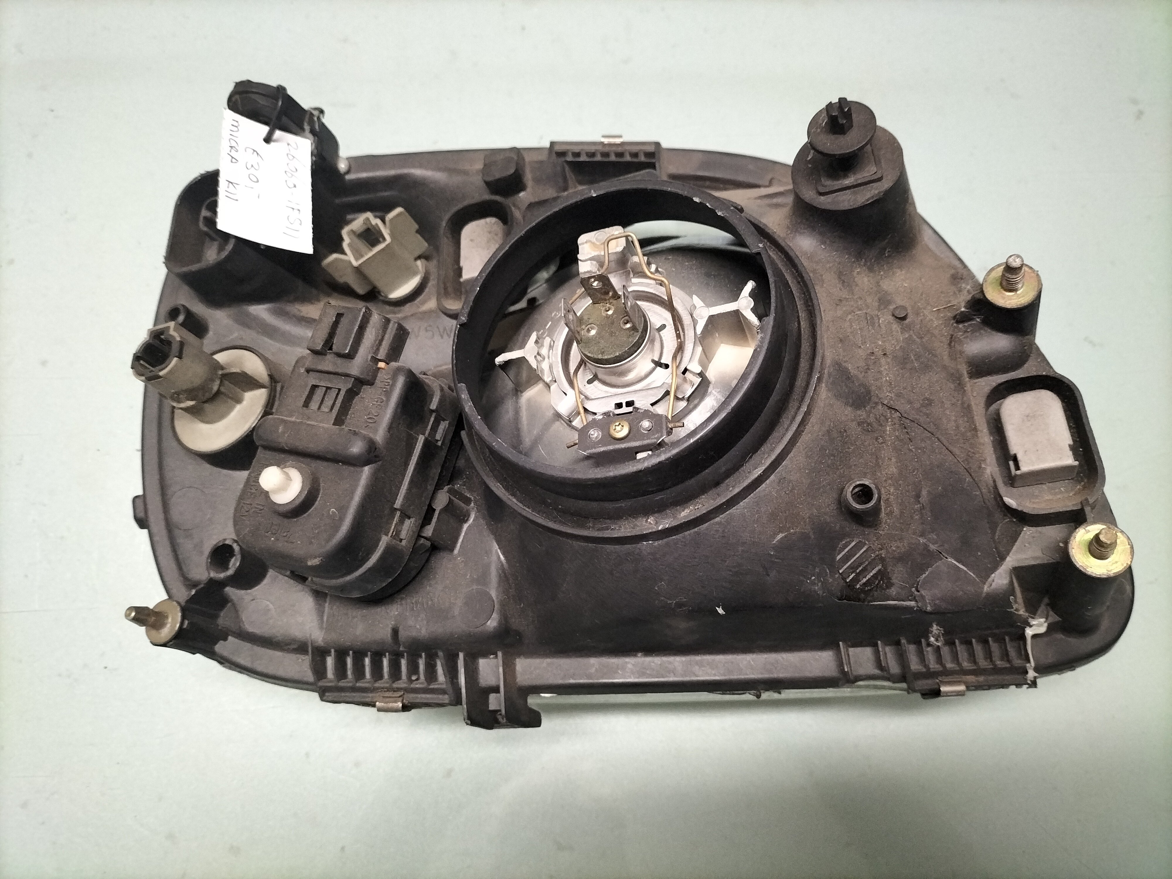 Koplamp Links Nissan Micra K11 26060-1F511 Gebruikt, gerepareerd.