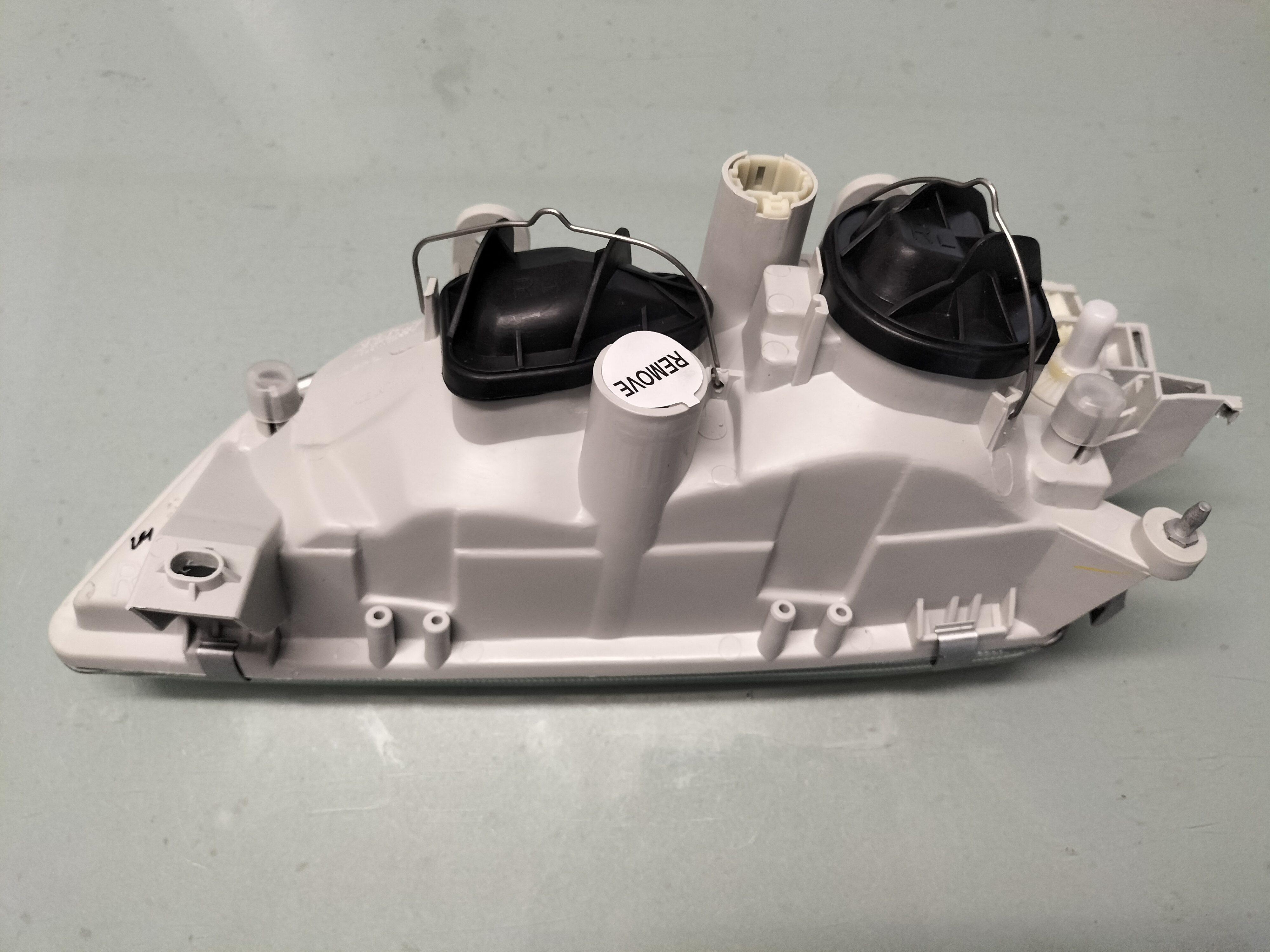 Headlamp assy-right hand Nissan Primera P11 26010-2F925 Nieuw.