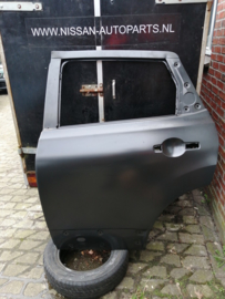 Portier linksachter Nissan Qashqai J10 H2101-JD0M0 Lichte schade/ Origineel.