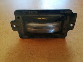 Cover-licence lamp Nissan 100NX B13 26512-70Y00 (IKI 6133) Used part.
