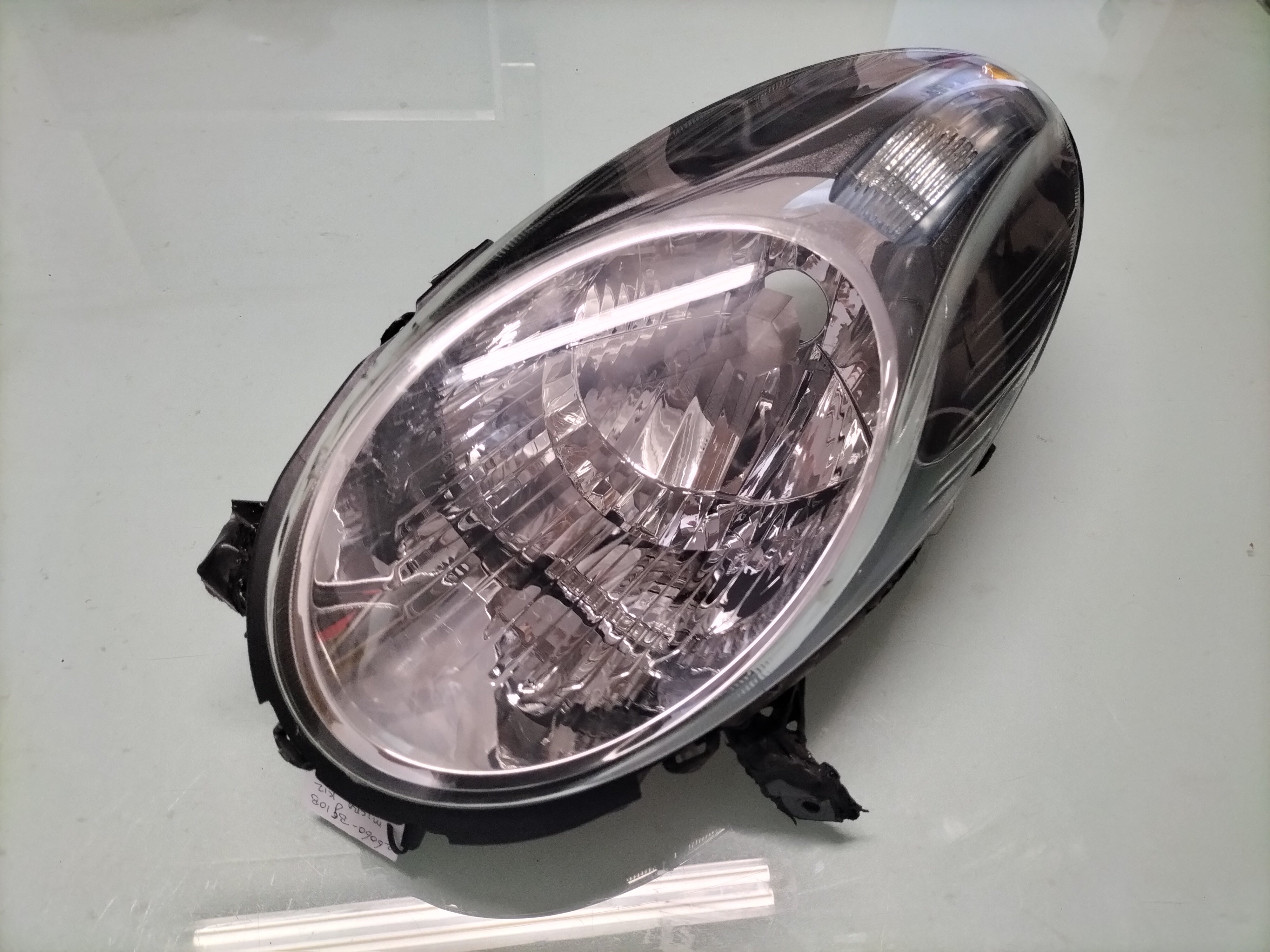 Koplamp Links Nissan Micra K12 26060-BG10B Gebruikt. Gerepareerd.