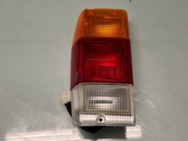 Achterlicht links Nissan Vanette C120 26555-G4002 Origineel.
