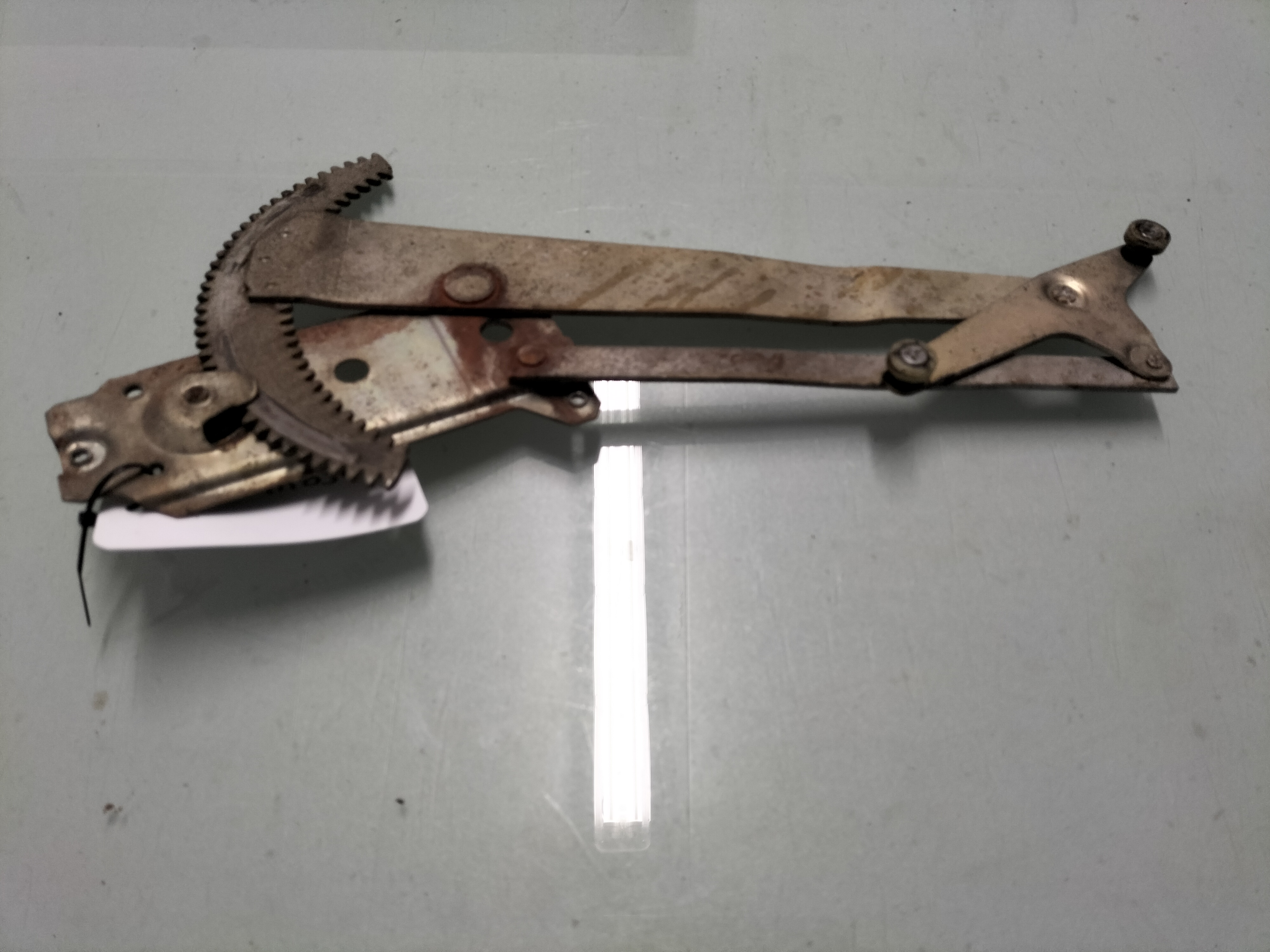 Assy-regulator, door window left-hand Datsun Cherry E10 82701-M0300 Used part.