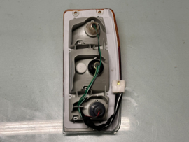 Achterlicht links Nissan Vanette C120 26555-G4002 Origineel.
