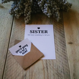 Envelopkaart ''We have something to tell you'' - sister