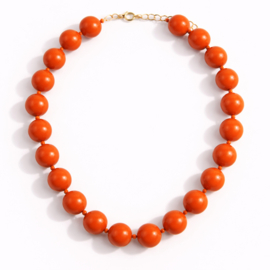 Oranje kralenketting met grote glanzende kralen