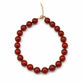 Oranje kralenketting met grote glanzende kralen