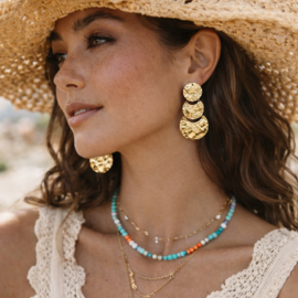 Goudkleurige statement clipoorbellen met ronde schijven