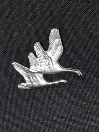 Pin flying swans