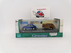 Volkswagen beetle met caravan