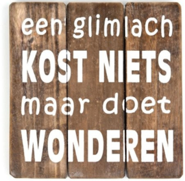 Tekst bord "een glimlach"