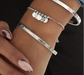 Bedelarmband hangende coins goud
