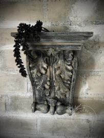 Stenen wandornament/ kandelaar