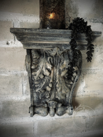 Stenen wandornament/ kandelaar