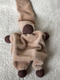 Cuddly doll apricot with dark skin color