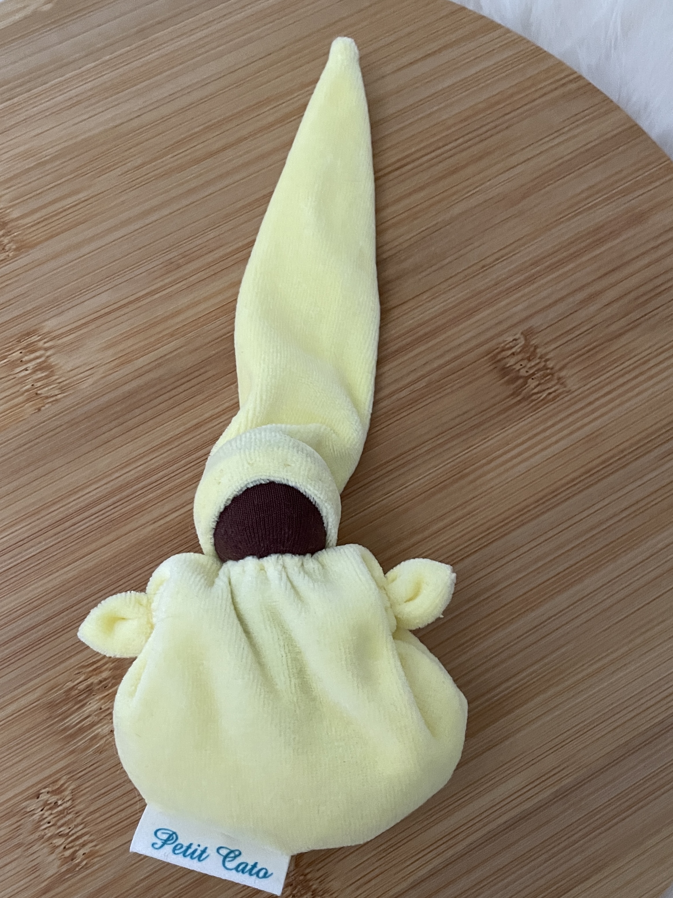 Petit Catootje - Crib doll - soft yellow - dark skin color