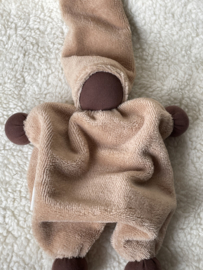 Cuddly doll apricot with dark skin color