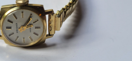 Antiek gouden dameshorloge met verende rekband en kast diameter  18mm