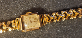 Vintage 18 kr gouden dames horloge  Olma met schakelband netjes.