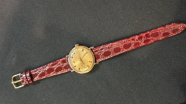 18 Kr gouden heren horloge met leren band  kast 33mm Enicar star jewels.